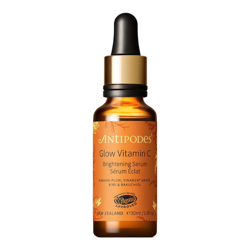 A 30ml amber glass dropper bottle of Antipodes Glow Vitamin C Brightening Serum with a black dropper cap and gold collar, set against a plain white background.
