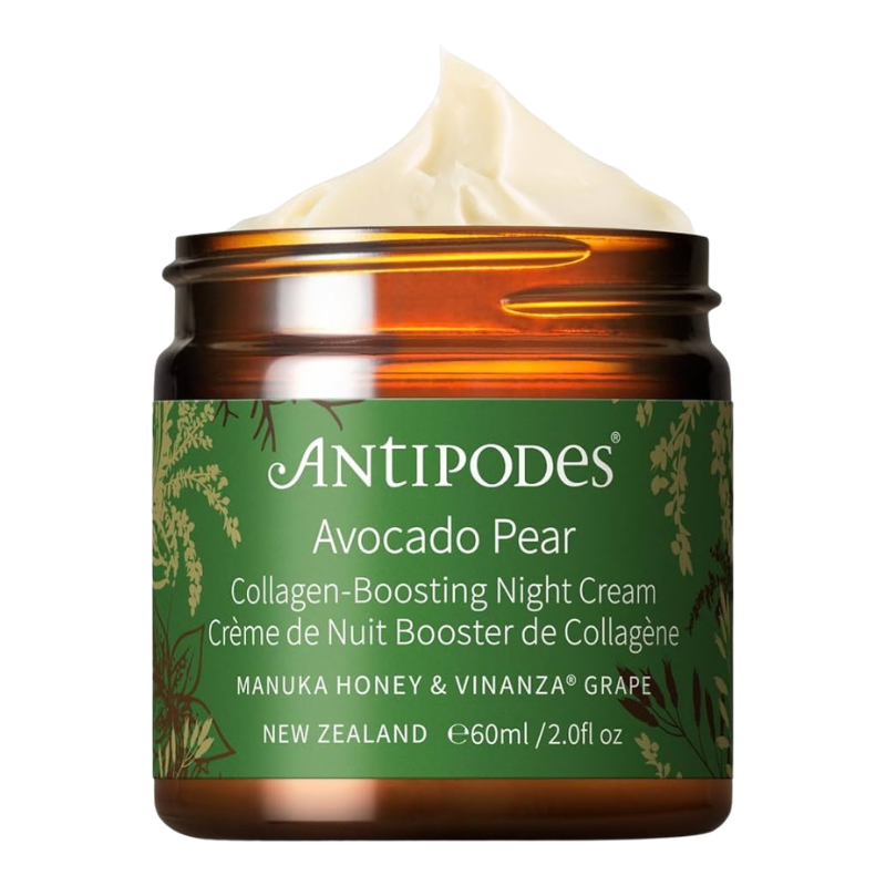 An amber glass jar of AntiPodes Avocado Pear Collagen-Boosting Night Cream with a green label and a swirl of cream visible at the top, on a white background.