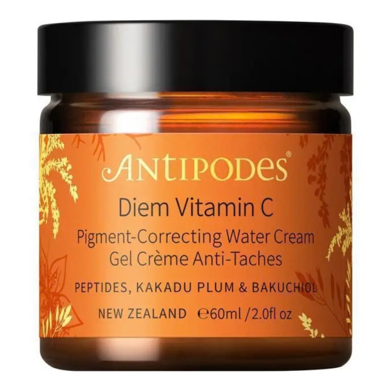 A jar of Antipodes Diem Vitamin C Pigment-Correcting Water Cream, featuring an amber brown glass jar with a black lid and an orange label with gold botanical accents.
