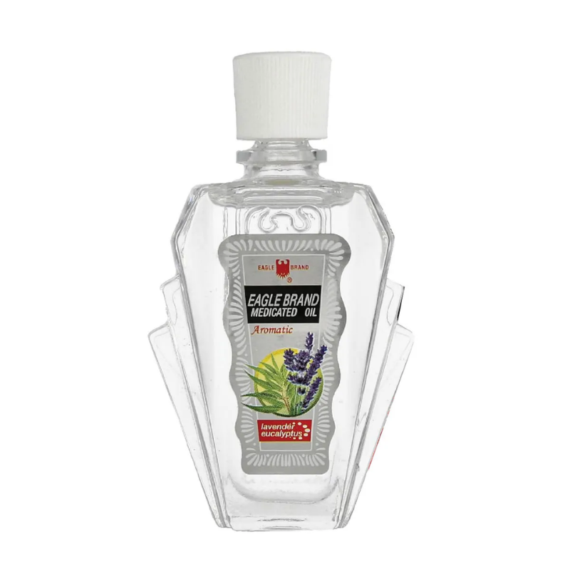 Clear bottle of Eagle Brand massage oil with label on a white background