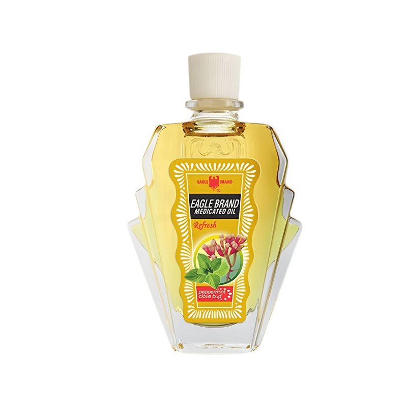 Bottle of Eagle Brand medicated oil on a white background