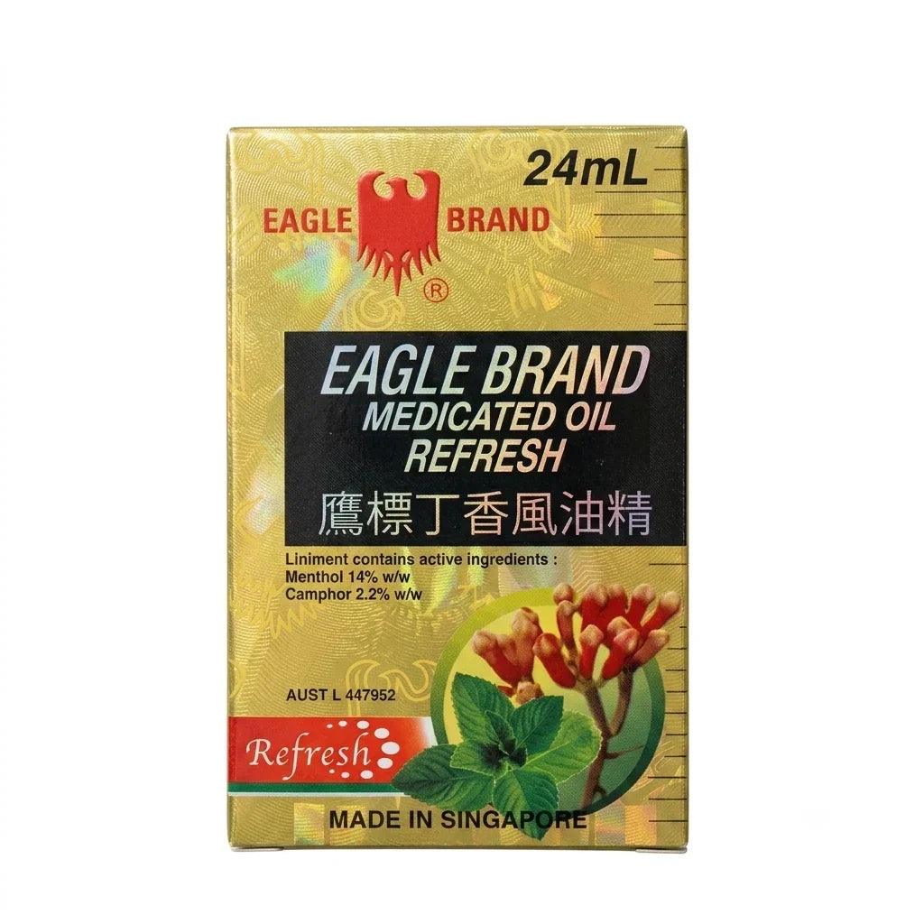 A 24mL box of Eagle Brand Refresh Medicated Oil Liniment, featuring a gold and black design with a red eagle logo and an illustration of red flowers and green leaves.