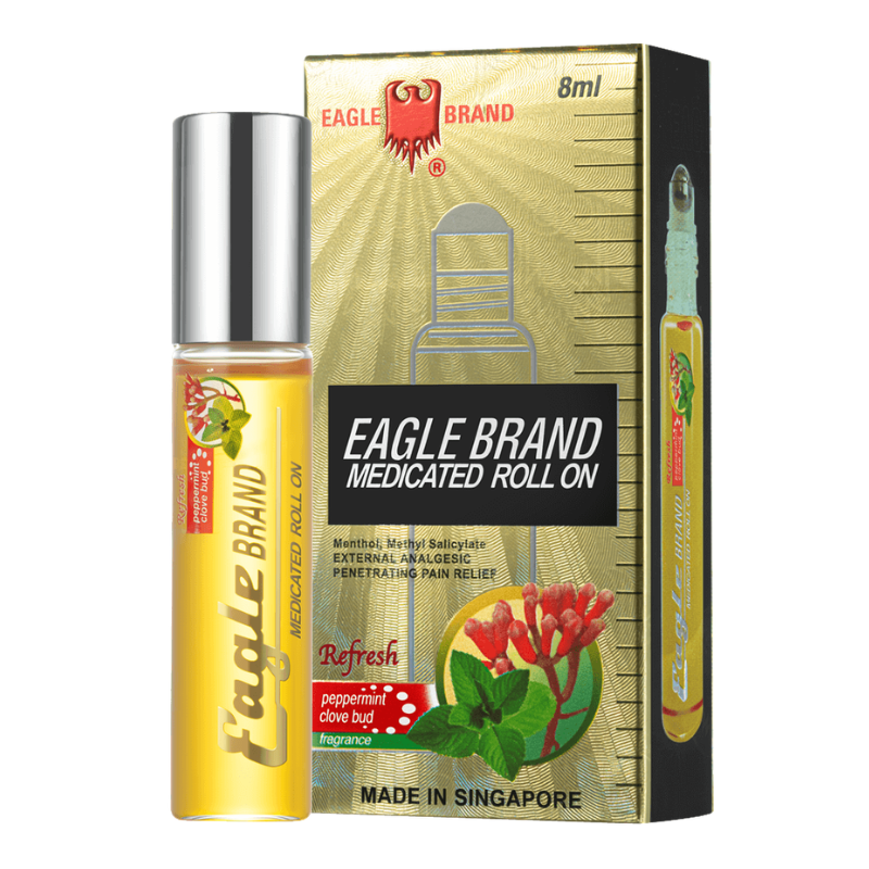 Eagle Brand Medicated Roll On bottle and its packaging box, featuring a golden-yellow liquid, a silver cap, and a gold box with red and green graphics.