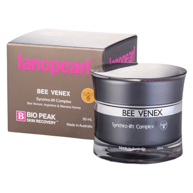 A jar of Lanoparl Bee Venex Synchro-lift Complex skin cream next to its brown and pink packaging box on a white background.
