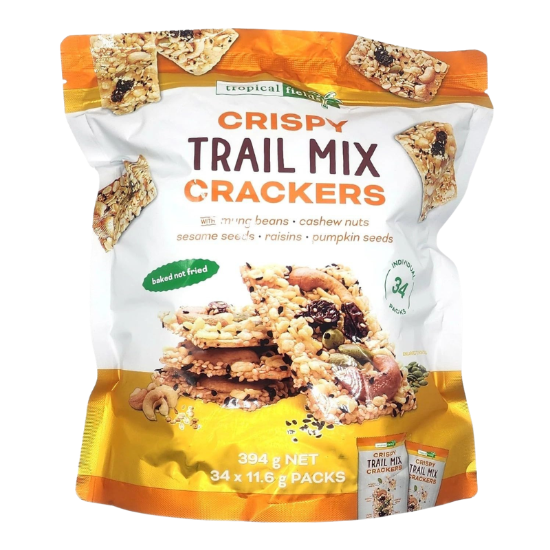 A bag of Tropical Leaves Crispy Trail Mix Crackers, featuring a white, orange, and yellow packaging design with an image of a trail cracker on the front.