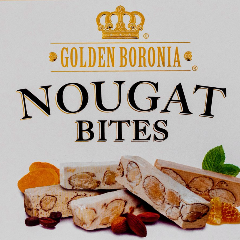 Golden Boronia Nougat Bites packaging featuring a white background with a gold crown logo, bold black and gold text, and illustrations of nougat bars with almonds, dried fruit, honeycomb, and mint leaves.