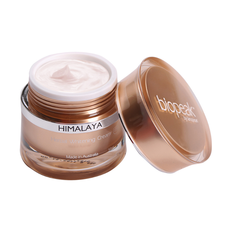 Himalaya skincare cream jar with open lid on a white background