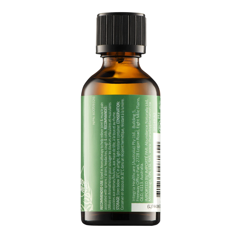 An amber glass bottle with a black ribbed cap and a green label, shown from the back on a plain white background.