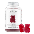 A bottle of Teddi Lab by Unichi Cranberry Extract Gummy supplements, featuring a white label with a red gummy bear graphic, alongside two loose red gummy bears on a clean white background.